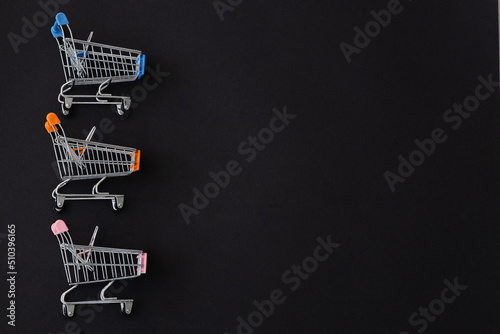 Shopping trolleys minimal on black background