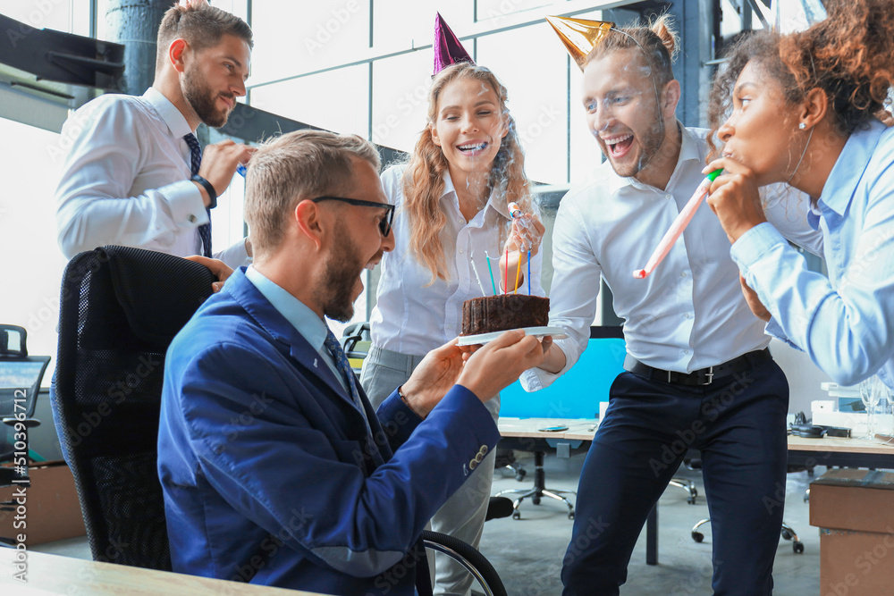 Business team celebrating a birthday of collegue in the modern office Business team celebrating a birthday of collegue in the modern office