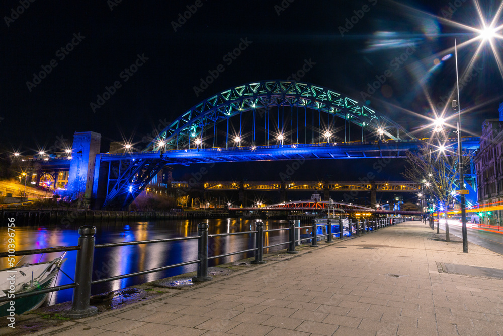 Newcastle upon Tyne UK - 6th February 2018: Tyne Bridge illuminated on the Quayside view at night with car light trails