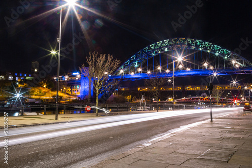 Newcastle upon Tyne UK - 6th February 2018: Tyne Bridge illuminated on the Quayside view at night with car light trails