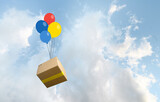 Parcel box delivered by colored baloons in the sky