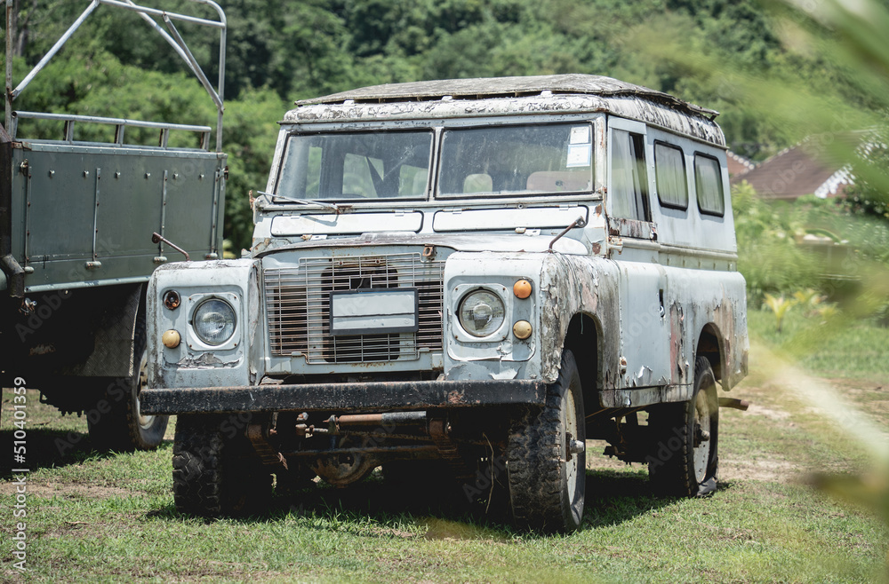 Old rusty cars for safari in the jungle of Africa