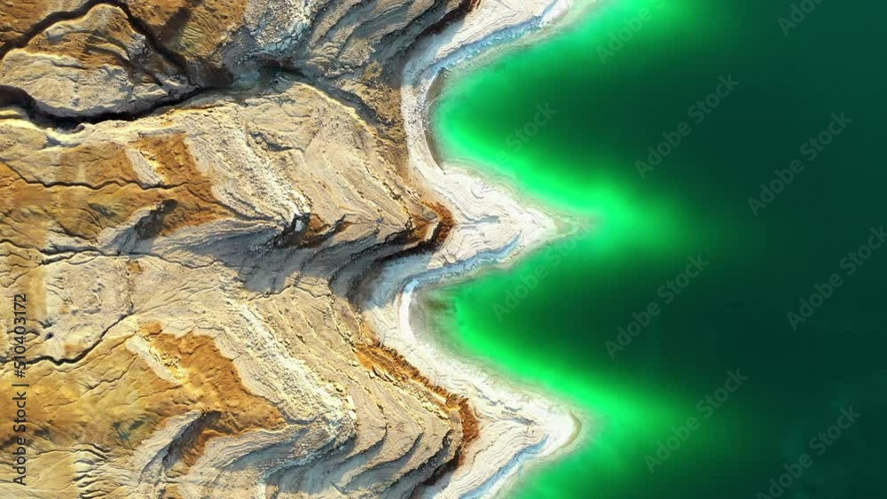 Aerial Top Forward Beautiful View Of Green Lakeshore By Rock Formations - Jordon Rift Valley, Jordan