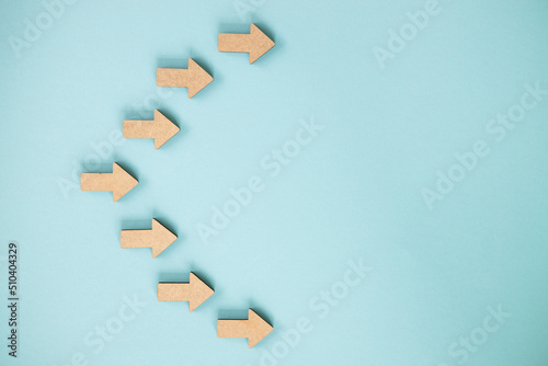 Business investment growth concept , Wooden arrows on blue background