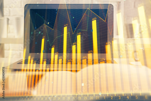 Stock market graph and table with computer background. Multi exposure. Concept of financial analysis.