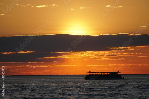 Silhouette of a boat overlooking the beautiful sunset near Cape Henlopen State Park, Lewes, Delaware, U.S © K.A