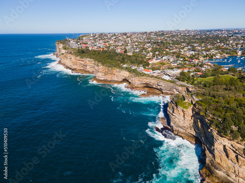 Aerial drone view of Watsons Bay in East Sydney, Australia along the coastal clifftop at The Gap famous lookout on a sunny day