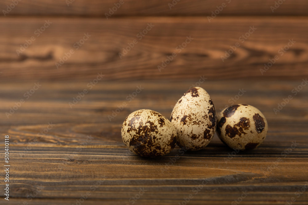 Quail eggs on a brown texture background.Organic food. Place for text. Fresh quail eggs. Quail eggs on a brown texture background.Organic food. Place for text. Fresh quail eggs.