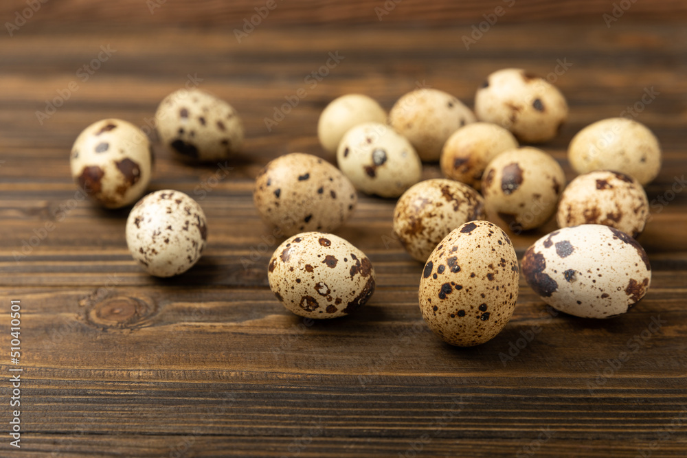 Quail eggs on a brown texture background.Organic food. Place for text. Fresh quail eggs. Quail eggs on a brown texture background.Organic food. Place for text. Fresh quail eggs.