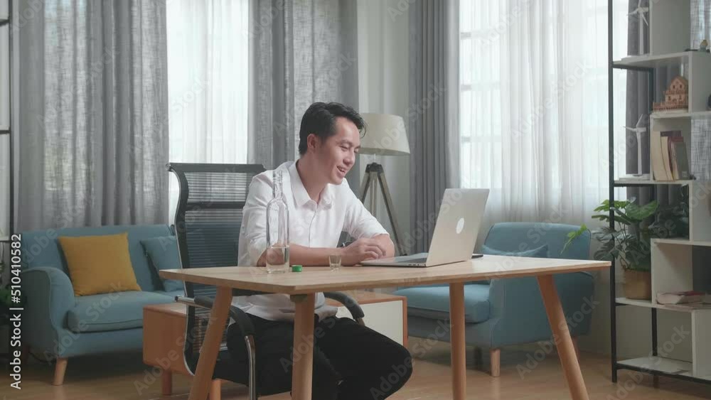 Drunk Asian Man Drinking Vodka During Having Video Call On A Laptop At The Home
Drunk Asian Man Drinking Vodka During Having Video Call On A Laptop At The Home