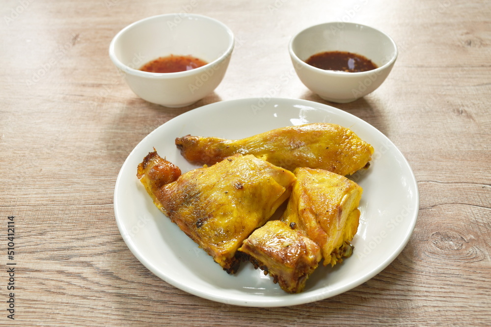 grilled chop chicken on plate dipping with spicy and sweet chili sauce grilled chop chicken on plate dipping with spicy and sweet chili sauce