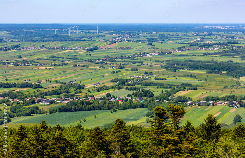 Panorama of Gory Swietokrzyskie Mountains and valleys with Starachowice and Kielce region villages seen from Swiety Krzyz mount hilltop near Nowa Slupia village in Poland
