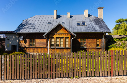 Reconstructed wooden country house aside St. Catherine Benedictine convent in Swieta Katarzyna village in Swietokrzyskie Mountains in Poland