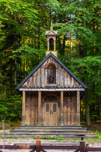 Traditional forest shrine of St. Francis in Swieta Katarzyna village near Bodzentyn at tourist path to Lysica peak in Swietokrzyskie Mountains in Poland