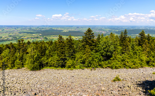 Fototapeta Naklejka Na Ścianę i Meble -  Panorama of Gory Swietokrzyskie Mountains and valleys with Goloborze Lysa Gora stone run slopes on Swiety Krzyz mount hilltop near Nowa Slupia village in Poland