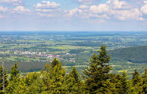 Panorama of Gory Swietokrzyskie Mountains and valleys with Starachowice and Kielce region villages seen from Swiety Krzyz mount hilltop near Nowa Slupia village in Poland photo