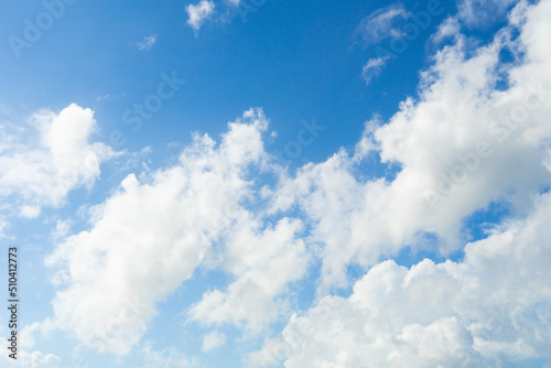 White clouds with blue sky background copy space. Sunshine day with beautiful clouds. Blue nature sky background and clouds.