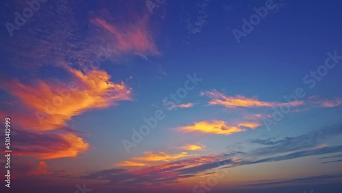 Beautiful sky clouds nature landscape at sunset. Colorful clouds move on the blue sky. 