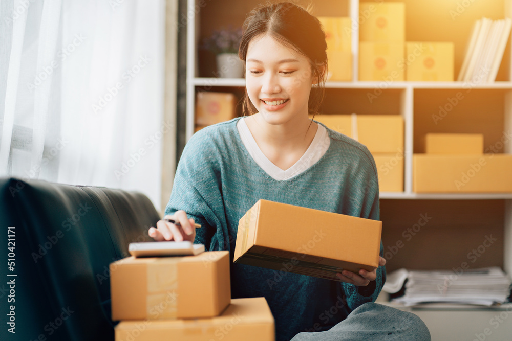 Asian teenager owner business woman work at home for online shopping and sale. Asian teenager owner business woman work at home for online shopping and sale.