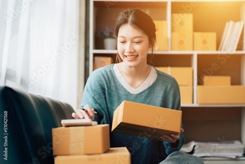 Asian teenager owner business woman work at home for online shopping and sale.