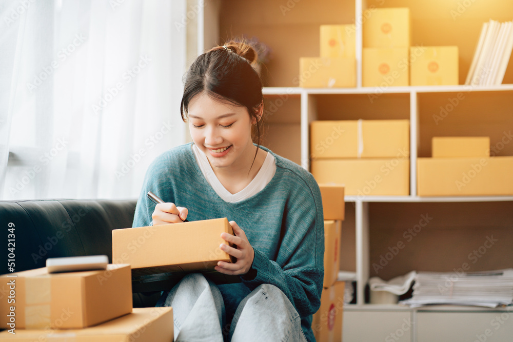 Asian teenager owner business woman work at home for online shopping and sale. Asian teenager owner business woman work at home for online shopping and sale.