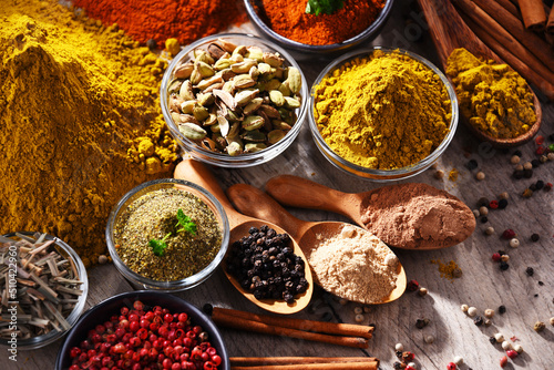 Fototapeta Naklejka Na Ścianę i Meble -  Variety of spices on kitchen table