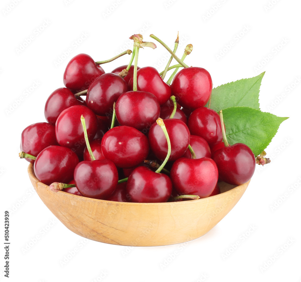 Cherries in the wooden cup isolated on white background. Cherries in the wooden cup isolated on white background.