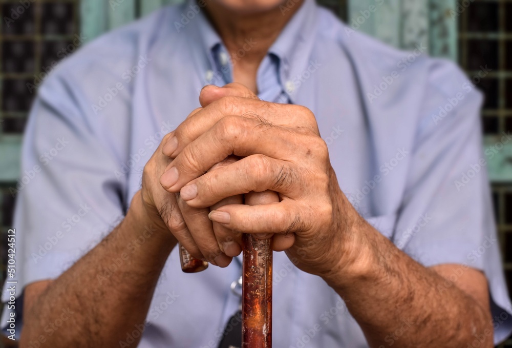 Hand of Asian elder man. Concept of rheumatoid arthritis, osteoarthritis, or joint pain Hand of Asian elder man. Concept of rheumatoid arthritis, osteoarthritis, or joint pain