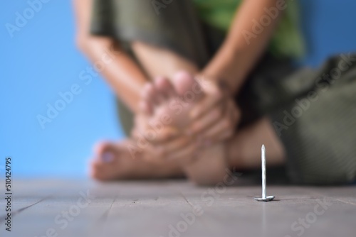 Concept of nail penetrating injury and tetanus.