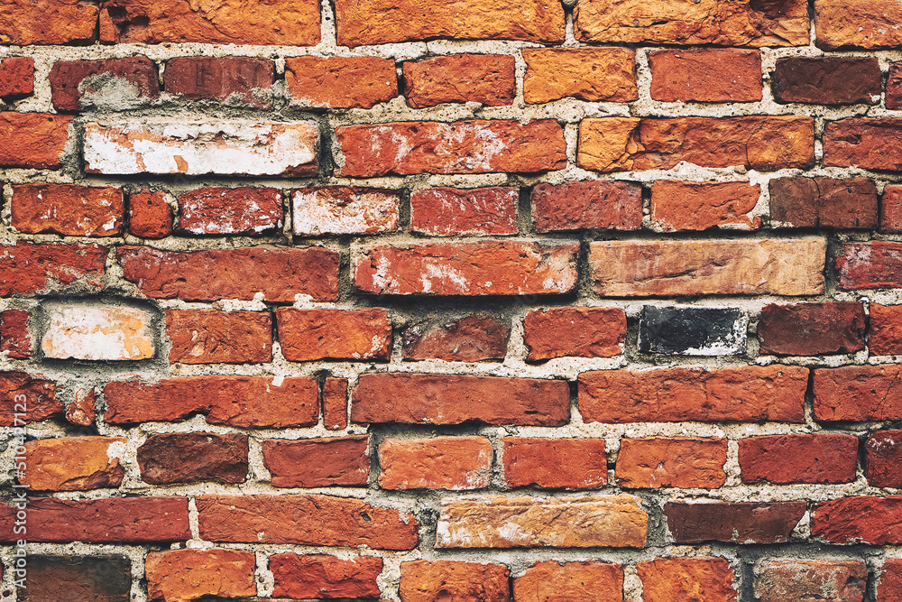 Fototapeta premium Old brick wall, grunge background. Front view