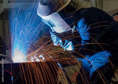 The welder is welding steel plates