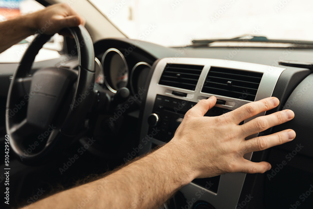Male Driver Pushing Button On Control Panel Driving Car, Closeup