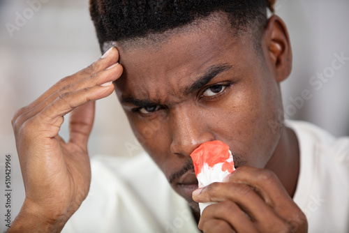 young black man suffering from sinusitis photo