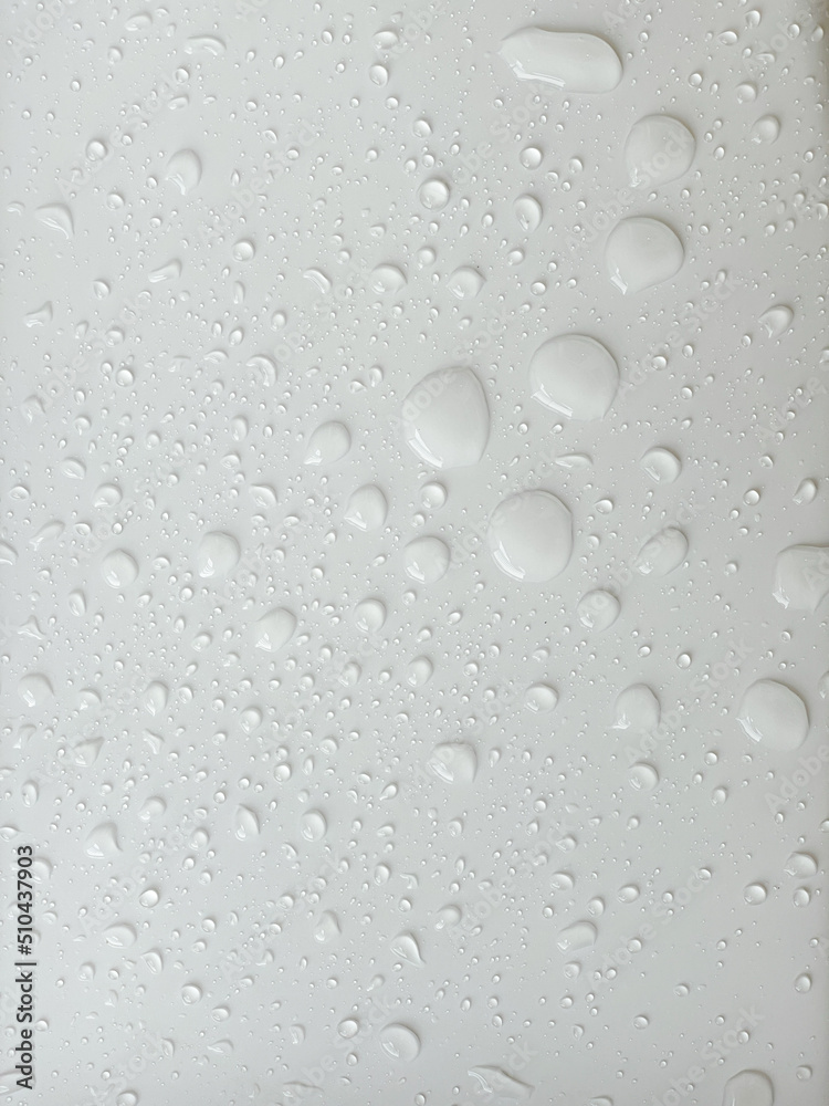 Water droplets on a white background. For background about drizzling rain with natural drops. Water droplets on a white background. For background about drizzling rain with natural drops.