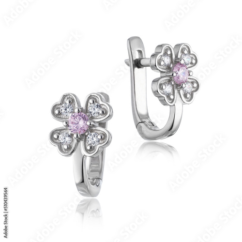 silver earrings on a white background