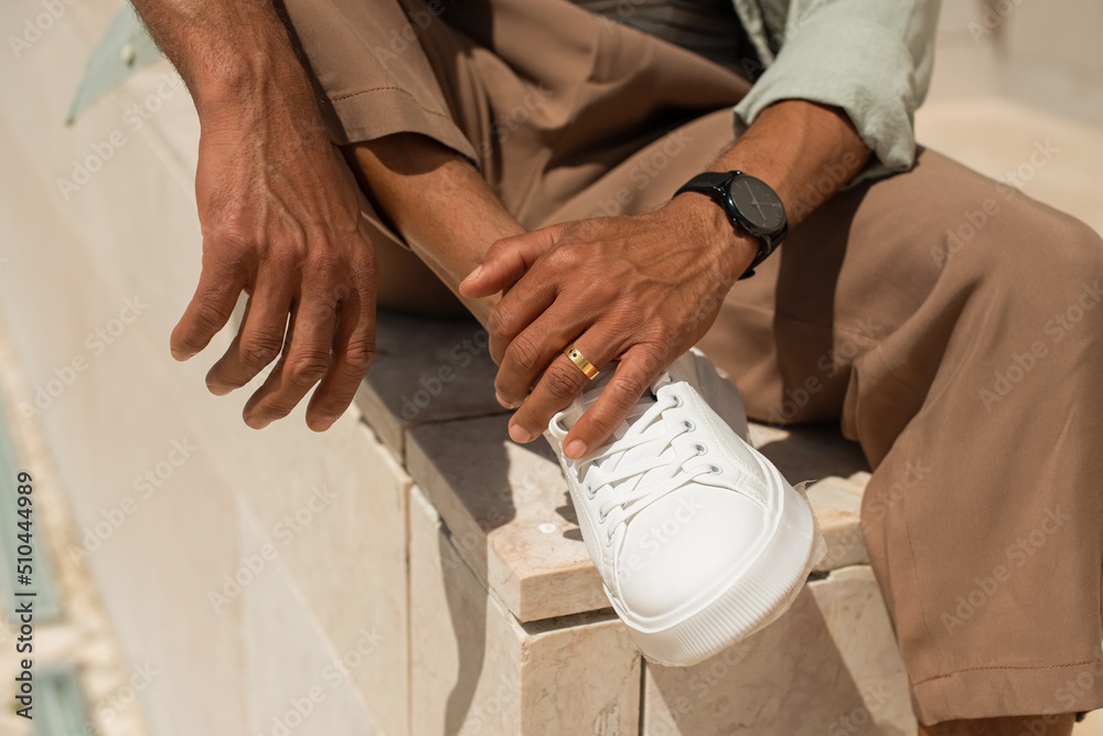 Close-up of African American man hands. Male hands with ring and watch. Stylish Black man concept