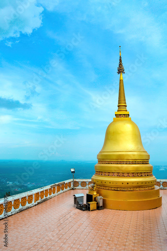 Buddhist tiger cave temple (Wat Tham Sue) in Krabi, Thailand. Gold pagoda.Sea of clouds