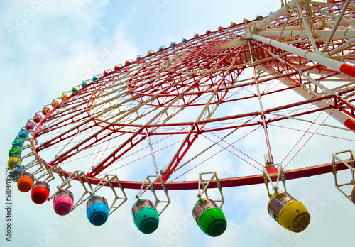 Colorful Ferris wheel with a sunny sky
