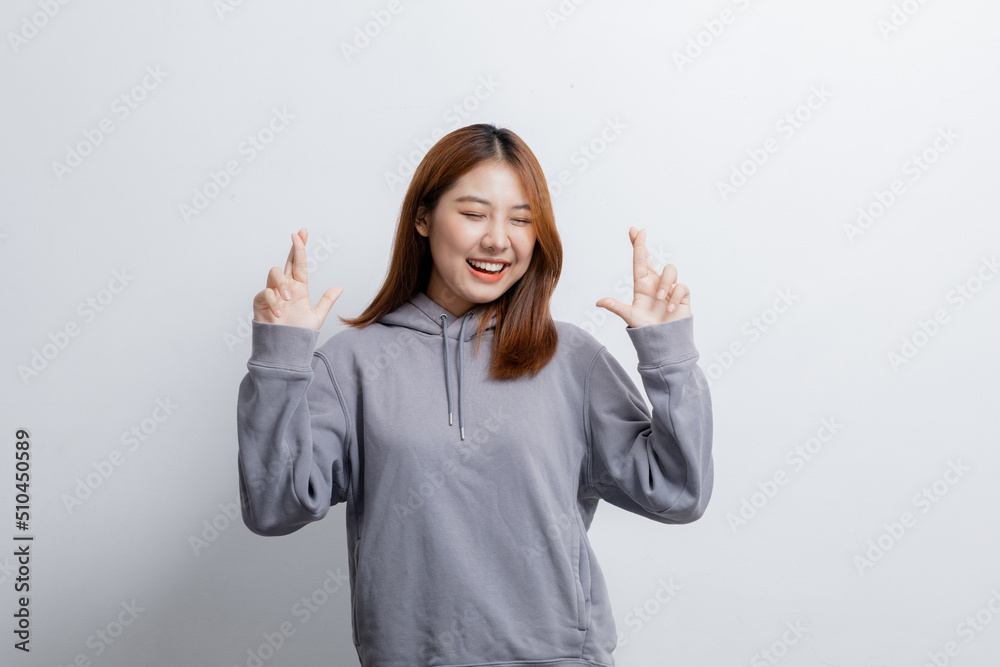 Portrait of beautiful Asian woman doing cheerful pose on isolated background, portrait concept used for advertisement and signage, isolated over white background, copy space. Portrait of beautiful Asian woman doing cheerful pose on isolated background, portrait concept used for advertisement and signage, isolated over white background, copy space.