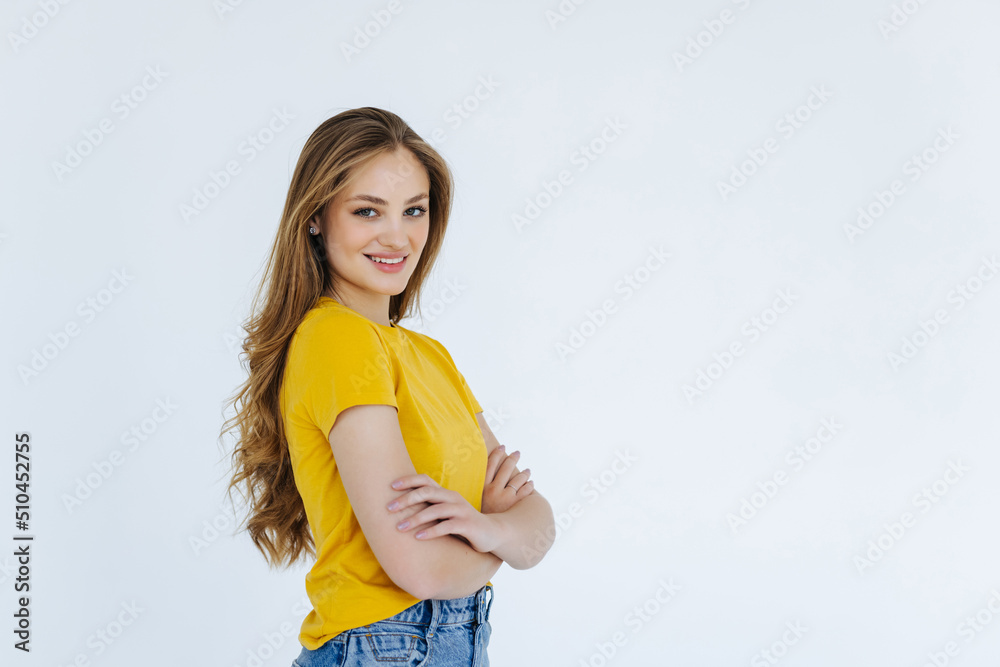 Portrait of smiling confident woman feeling ready and determined, cross arms on chest self-assured looking at camera, standing against white background Portrait of smiling confident woman feeling ready and determined, cross arms on chest self-assured looking at camera, standing against white background