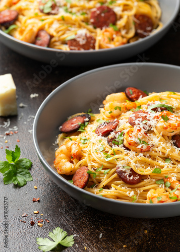 Prawn and chorizo pasta with cheese and herbs