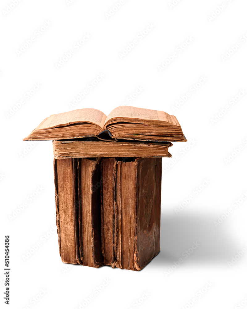 Open pages of Torah on stack of old worn shabby Jewish books in leather binding on white background. Closeup. Selective focus.