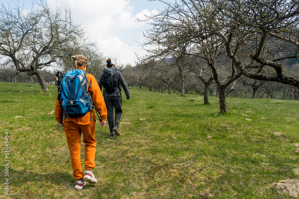 Tourist couple hike on nature with backpacks
