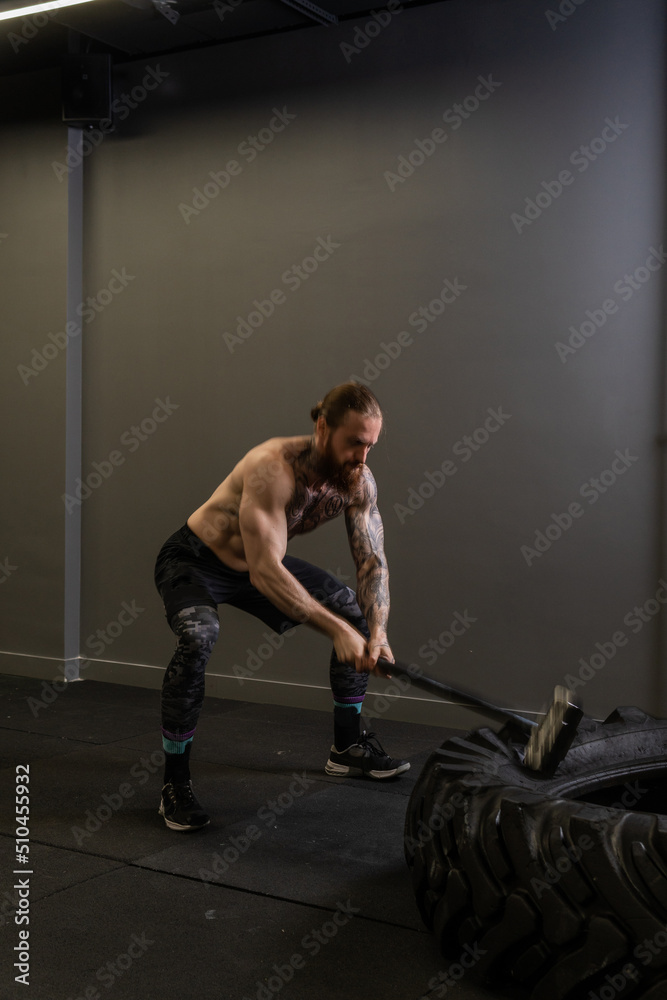 Tire sledge hammer muscular wheel man hitting exercise workout strength, concept equipment strong from athletic from sportswear concentration, male cross. Energy cardio adult, Tire sledge hammer muscular wheel man hitting exercise workout strength, concept equipment strong from athletic from sportswear concentration, male cross. Energy cardio adult,