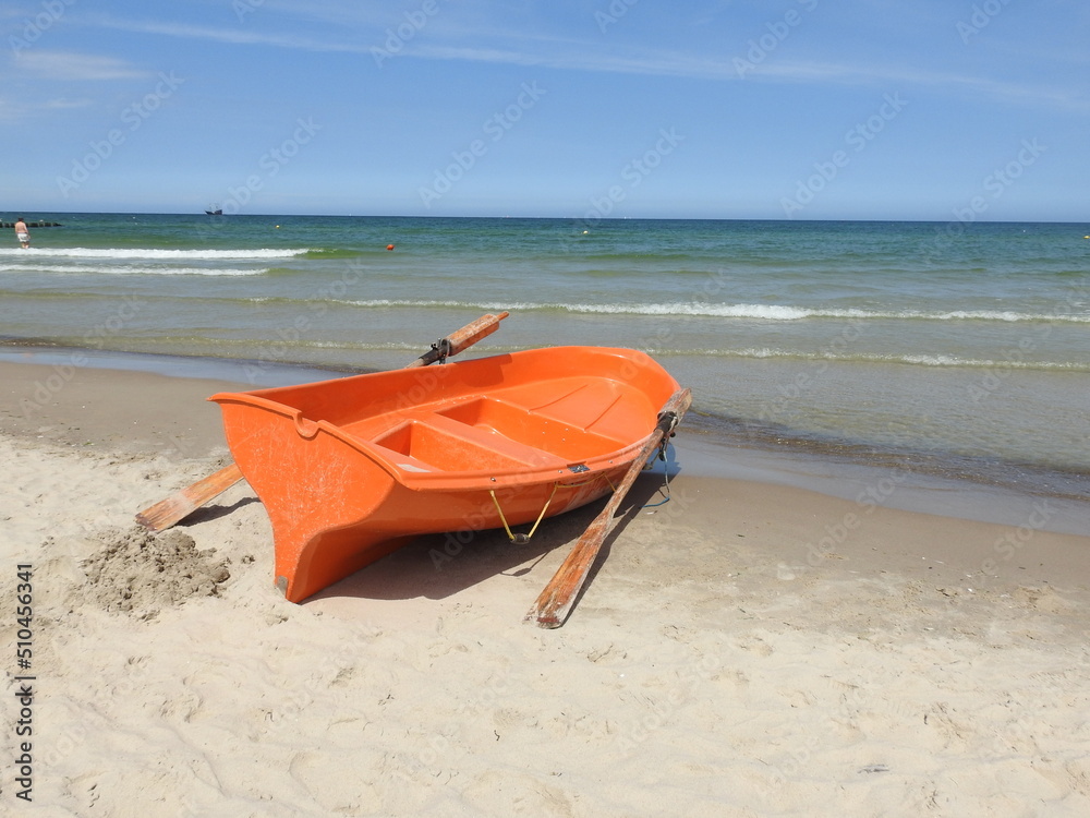 the lifeguard boat on the sea beach the lifeguard boat on the sea beach