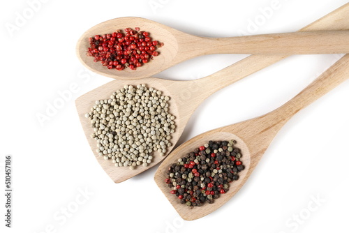 Set colorful, red and white grains pepper pile in wooden spoon isolated on white, top view