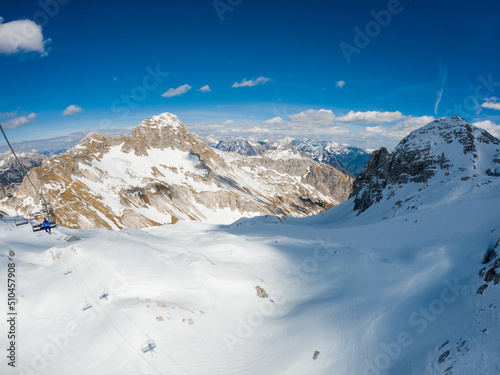 Spectacular high mountain winter panorama of alpine ski resort.