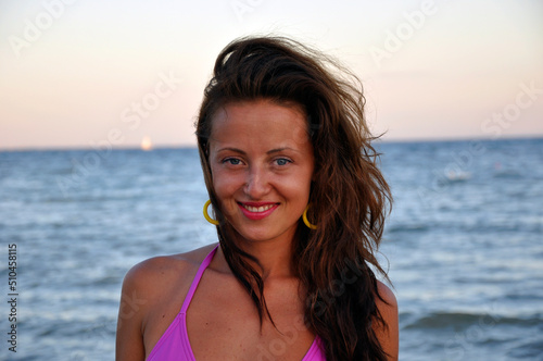 happy young mulato woman at sea beach