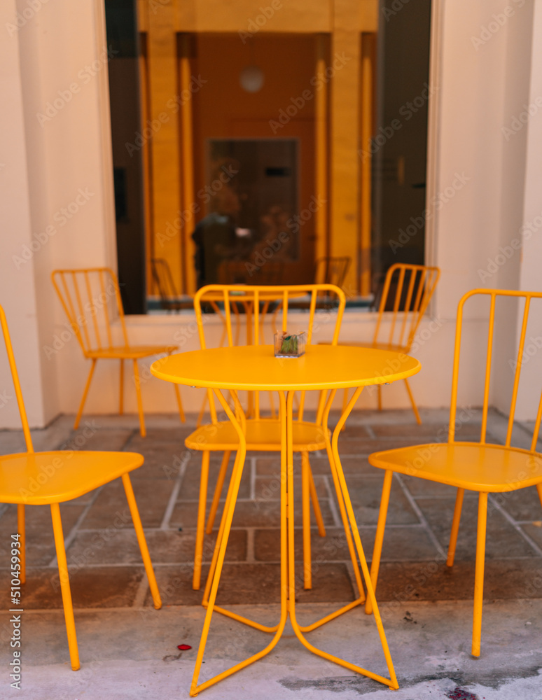 table and chairs in a cafe color yellow miami 