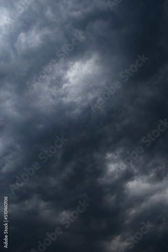 Canvas Print Dark rainy twisted thunderstorm clouds grey color vertical image